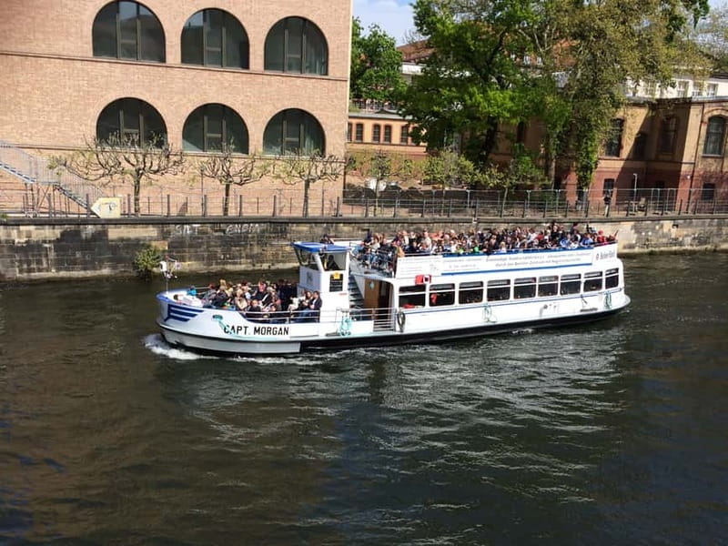 Berlin: Boat Sightseeing Cruise with Audioguide - Boarding at Domaquareé near the DDR Museum, and how the boat experience feels