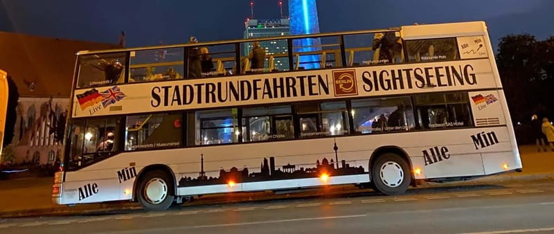 Berlin: Bus Tour by Night with Live Commentary - Alexanderplatz, Red Town Hall, and the World Clock at Night