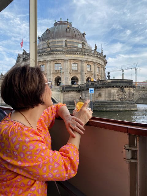 Berlin: Historic Boat Sightseeing City Center Tour - Onboard Comfort: Space, Music, Coffee, and the One Audio Caution